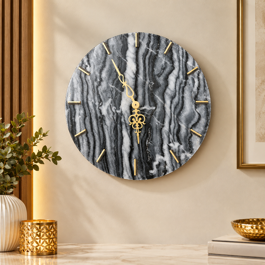 14 inch round black marble wall clock with gold markers in a luxury modern interior
