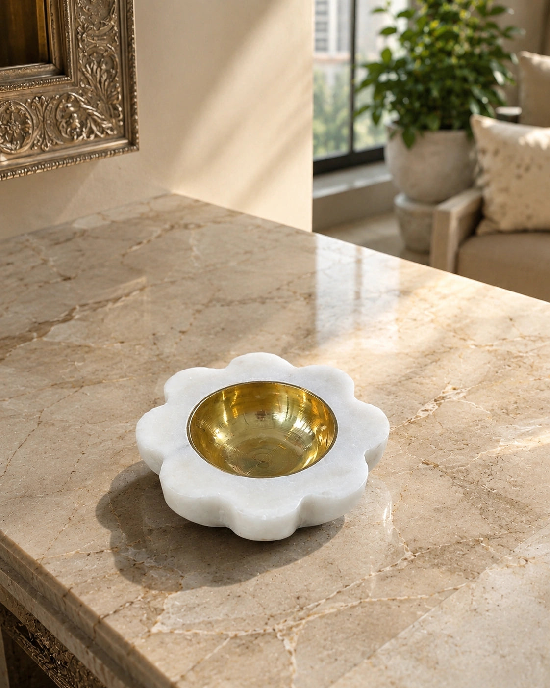 traditional Indian white marble diya with brass inner bowl glowing in home temple