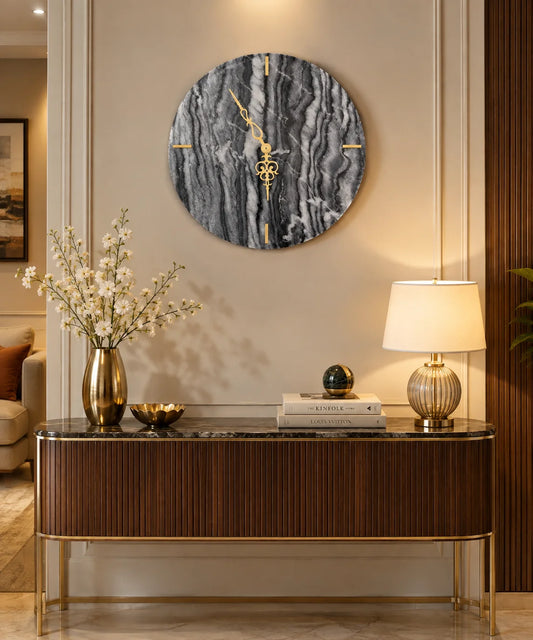 Black marble wall clock with gold hands and markers for luxury home decor