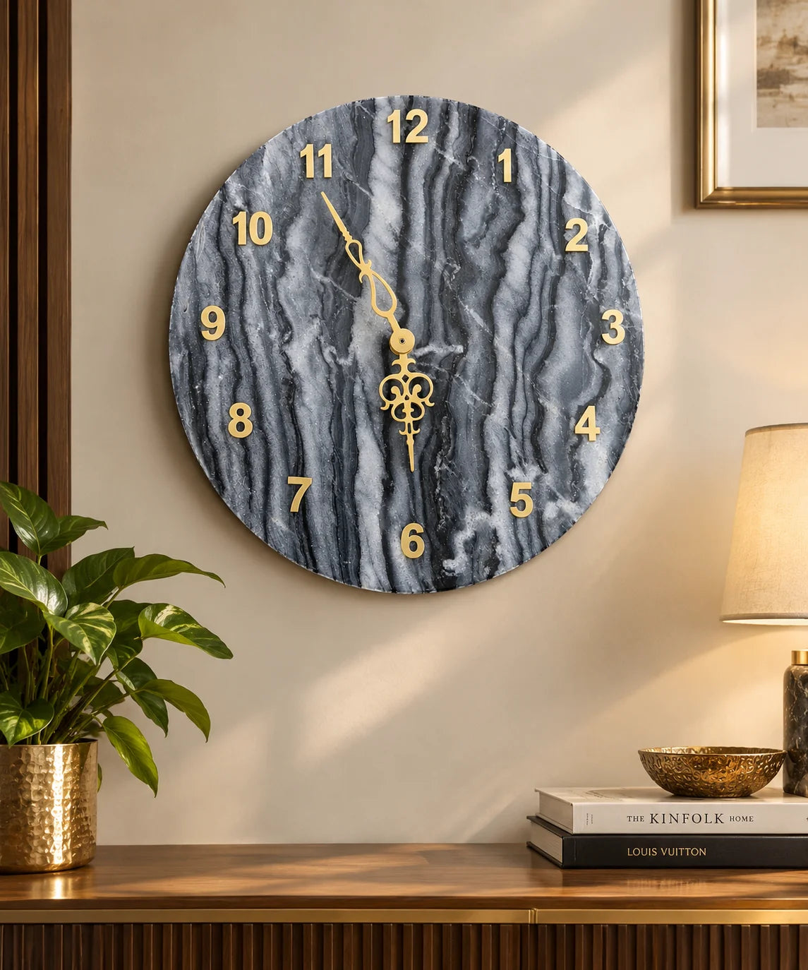 Luxury black marble wall clock with natural grey and white marble veining, elegant golden numerals and decorative gold hands by Reggal Decors, premium wall décor for modern homes.