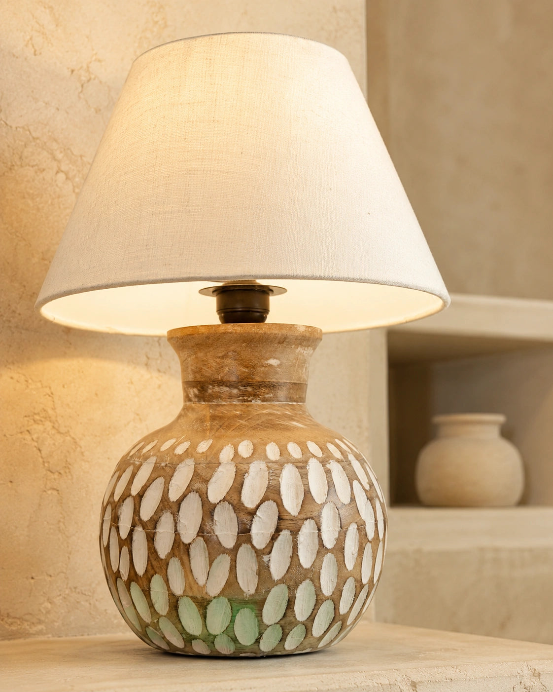 Close-up of brown wooden patterned table lamp with detailed decorative finish