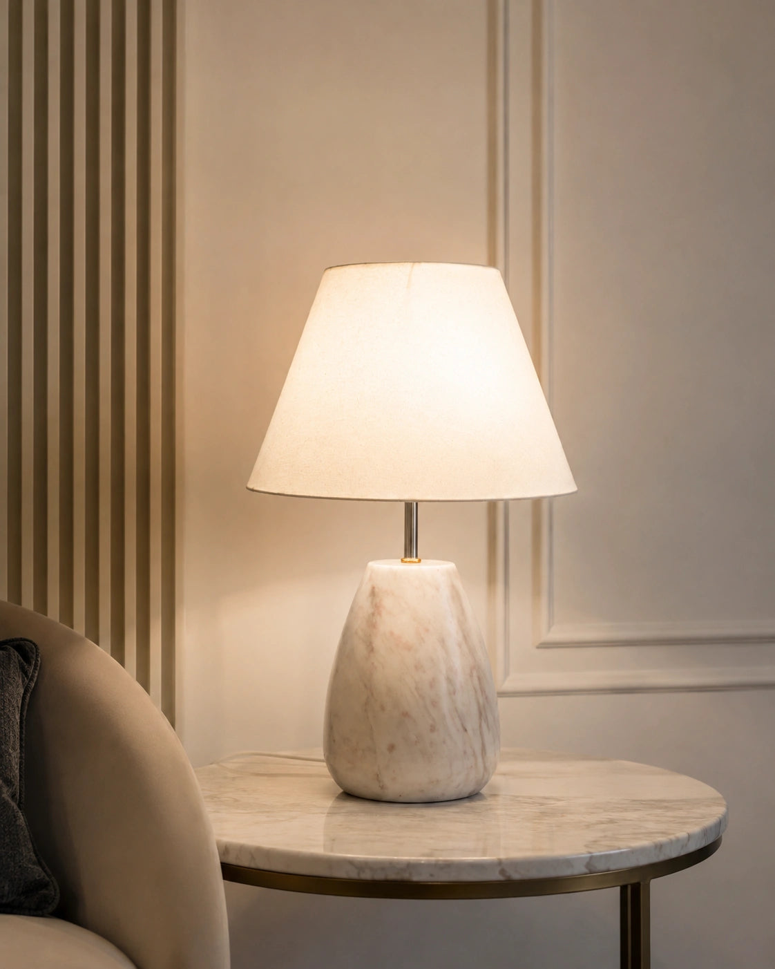White stone-look decorative table lamp with cream shade and gold-tone detailing by Reggal Decors